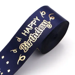 Blue gold stamped Happy Birthday ribbon detail, perfect for gift boxes and party decor.