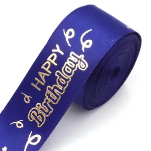 Blue satin ribbon with gold happy birthday foil print for gift wrapping and party decoration.