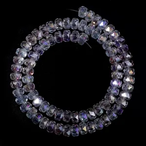 Faceted crystal rondelle spacer beads detail, shining rainbow refraction for DIY jewelry making.