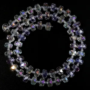 Detailed view of faceted rondelle crystal spacer beads, perfect for DIY jewelry and crafts.