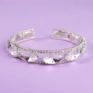 Silver open cuff bracelet featuring large clear crystals and double rhinestone rows for women.