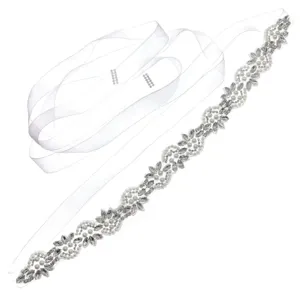 Elegant bridal rhinestone sash belt with white ribbon and sparkling crystals for wedding dress.