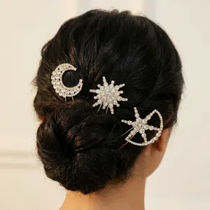 Detailed view of rhinestone star and moon hair pins set, elegant sparkling banquet bridal hair accessories.