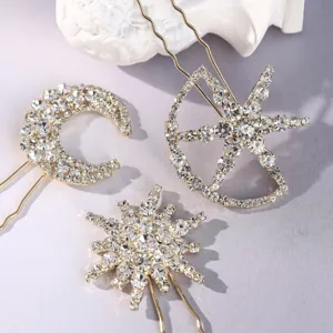 Rhinestone celestial hair pin set detail, golden metal moon and star hair accessories.