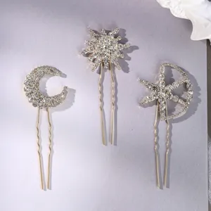 Detail shot of celestial rhinestone hairpins featuring moon and star designs for elegant updo.