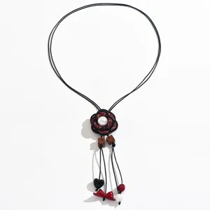 Long rope sweater chain featuring fabric flower pendant and pearl, trendy Korean style jewelry.