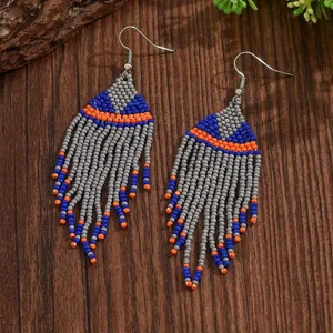 Bohemian handmade geometric seed bead fringe earrings detail view showing colorful tiny beads.