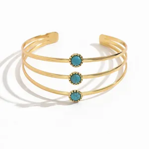 Bracciale manchette aperto multistrato alla moda con pietre turchesi, gioielli geometrici dorati.