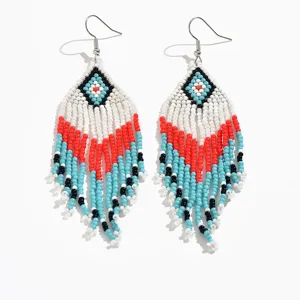 Handmade boho seed bead long tassel earrings with geometric diamond pattern and vibrant fringe style.