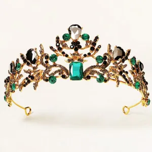 Vintage gold tiara with green and black rhinestones, detailed craftsmanship, bridal hair accessory.