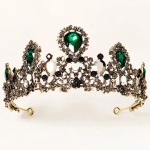 Vintage green rhinestone crown detail, elegant gold metal tiara for bridal or party wear.