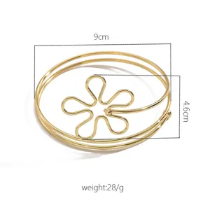 Bracciale da braccio geometrico cavo dorato da donna, catena per il corpo aperta minimalista.