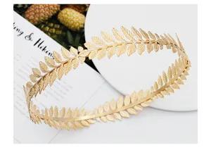 Gold leaf metal crown tiara detail shot, baroque bridal hair accessory, elegant circular headband.