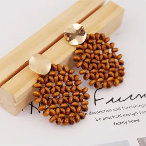 Bohemian handmade wooden bead drop earrings with chic gold metal disc studs for women.