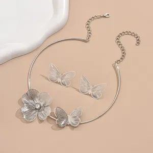 Elegant 3D butterfly choker and earrings set featuring hollow floral designs in silver.