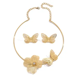 Gold-tone hollow butterfly choker necklace and matching earrings elegant fashion set.