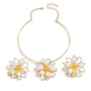 Chic gold enamel flower jewelry set, featuring hollow double-layer petal necklace and earrings.