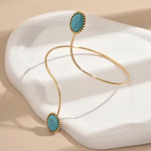 Elegante bracciale da braccio dorato con pietre turchesi, catena da corpo geometrica trendy.