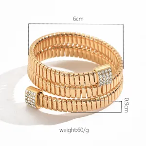 Detailed view of the multi-layer spring bracelet, showing 6cm width and rhinestone ends.