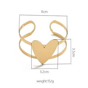 Gold metal open cuff bracelet detail view, featuring geometric heart design, elegant size specs.
