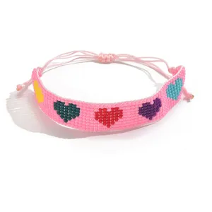 Bracelet de perles de rocailles tissées roses avec motifs cœurs multicolores bijoux