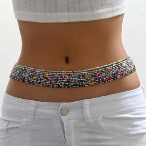 Close-up detail of colorful multi-strand beaded waist chain, bohemian body jewelry style.