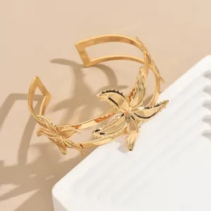Gold open arm cuff bracelet with geometric starfish design, chic personalized unique jewelry for women