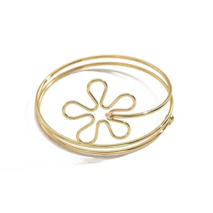 Bracciale da braccio aperto in metallo dorato minimalista con design di fiore cavo geometrico donna.