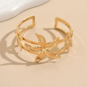 Gold starfish open cuff bracelet for women, geometric flower arm bangle, niche personality jewelry.