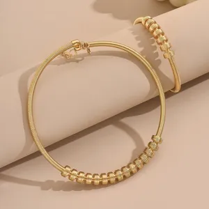 Gold coil choker and bracelet set geometric open cuff fashion jewelry detail display
