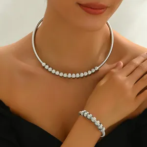 Silver metal choker necklace and bracelet set, trendy geometric coiled jewelry for women.