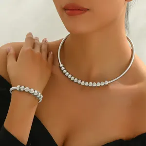 Silver tone spiral coil necklace and bracelet set for women, trendy niche design party jewelry.