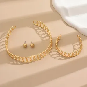 Gold-toned geometric hollow intertwined chain necklace bracelet and spherical stud earrings set.