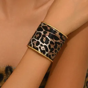 Exaggerated wide leopard print cuff bracelet for women, stylish metal edge fashion jewelry.