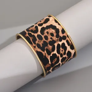 Wide leopard print cuff bracelet with metal edge, stylish geometric open bangle for women.