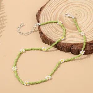 Bohemian green seed bead daisy choker necklace, handmade floral collar jewelry detail.
