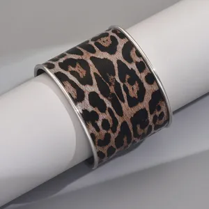 Wide leopard print cuff bracelet for women, stylish geometric open metal bangle winter jewelry.