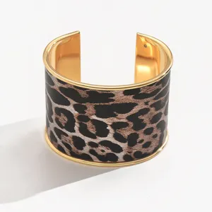 Chic leopard print wide metal cuff bracelet for women, stylish open geometric fashion jewelry.