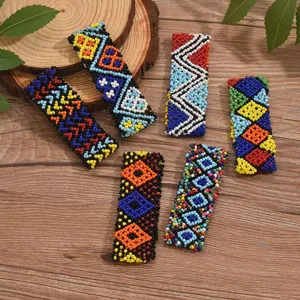 Detailed close-up shot of bohemian handmade seed bead bracelets showcasing colorful geometric patterns.
