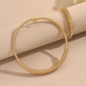 Ensemble de collier ras de cou et bracelet spirale dore, parure bijoux geometrique.