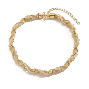 Gold twisted crystal choker necklace for women, trendy geometric party jewelry accessory.