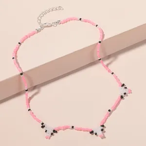 Korean bohemian seed bead cute cow necklace for women, trendy geometric animal charm pendant.