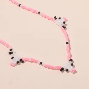 Detailed shot of Korean bohemian seed bead cute cow necklace for women chic animal pendant