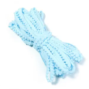 Light blue pom-pom fringe trim ribbon for DIY sewing crafts, garment accessories, and decor.