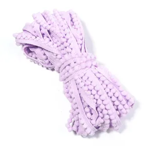 Light purple pom-pom fringe trim for DIY handmade hair clips, sewing, and home decor.