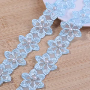 Details of light blue embroidered lace trim with pearl for DIY clothing and accessories.