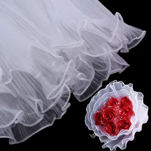 White tulle lace trim detail with red artificial rose bouquet for DIY handmade crafts apparel decor