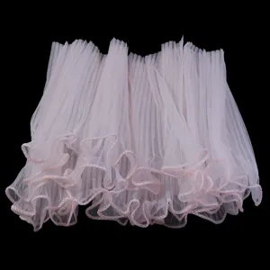 Detailed view of light pink pleated tulle mesh lace trim for DIY crafts and clothing decor.