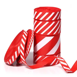 Red white diagonal striped grosgrain ribbon detail showing tight woven texture and holiday colors.