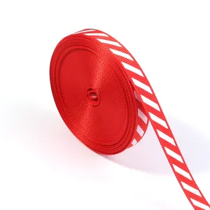 Close-up of red and white striped ribbon texture, perfect for holiday gift wrapping and DIY bows.